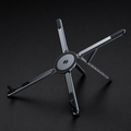 Graphite black MagFold device stand open on a charcoal studio backdrop
