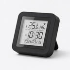 Compact smart-home monitor showing temperature humidity time and calendar